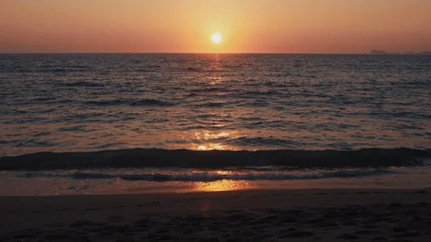 The Sun sets on a tropical sandy beach Stock Footage 119125006