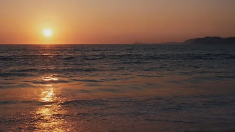 The Sun sets on a tropical sandy beach Stock Footage 119126192