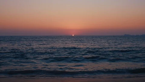 The Sun sets on a tropical sandy beach Stock Footage 119155515