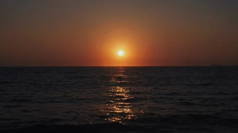 The Sun sets on a tropical sandy beach Stock Footage 119180097