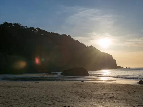 Sun setting above beach in San Francisco Stock Photos