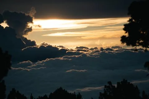 Sun setting above clouds from Volcan Acatenango at sunset Stock Photos