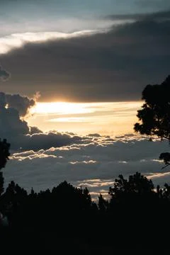 Sun setting above clouds from Volcan Acatenango at sunset Stock Photos