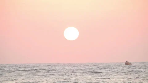 The sun setting above the ocean Stock Footage 32550837