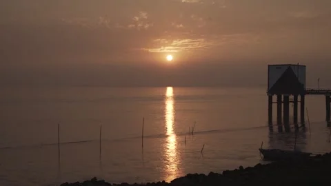 The sun is setting across the river. Stock Footage 248783482