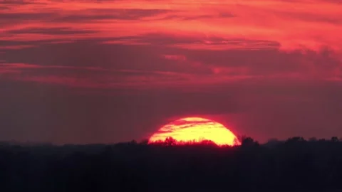 Sun Setting Against a Red Sky Stock-Footage 172268258