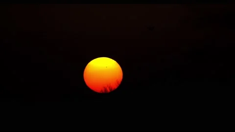 SUN SETTING AND SHOWING VISIBLE SUNSPOTS ON THE SURFACE Stock Footage 172550400