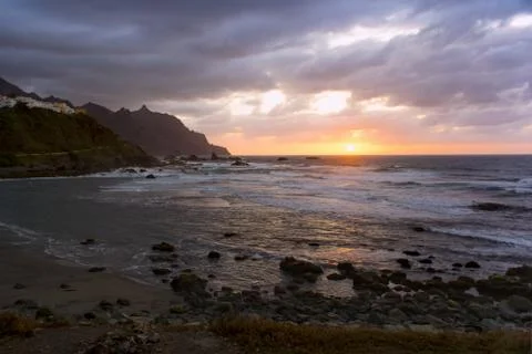 Sun setting in Atlantic ocean. View from Playa de Benijo, Tenerife Island Stock Photos