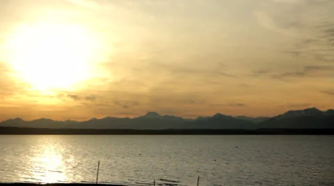 Sun Setting on Beach Mountain Range Stock Footage 25142740
