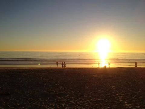 Sun setting at beach Stock Photos