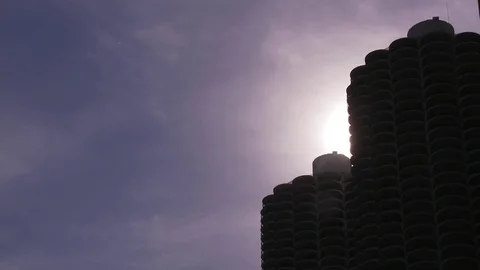 Sun setting behind aparment buildings Stock Footage 84467370