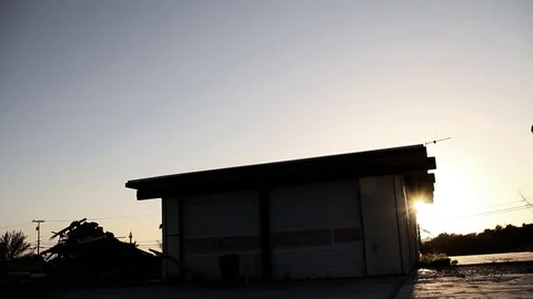 Sun setting behind building Stock Footage 95112906