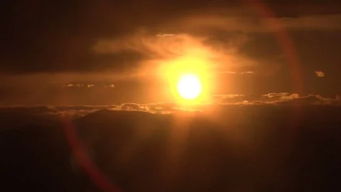 Sun setting behind clouds in beautiful sky Stock Footage 74096201