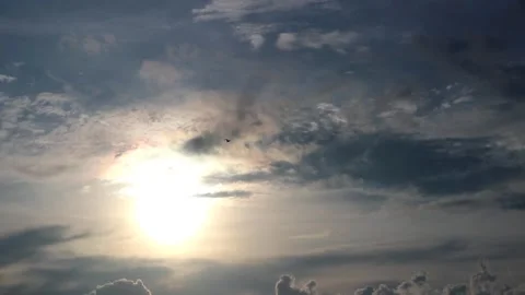 The sun is setting behind the clouds. Stock Footage 296823859