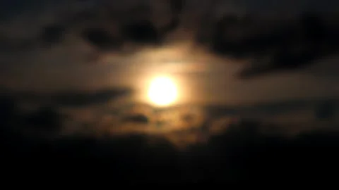 The sun is setting behind the clouds. Stock Footage 296823968