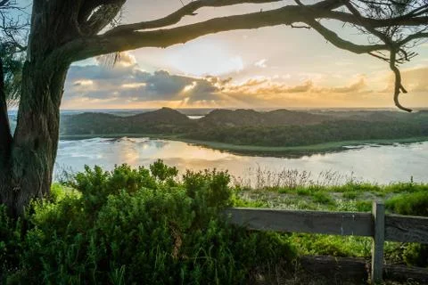 Sun setting behind the clouds in Tower hill wildlife reserve Stock Photos