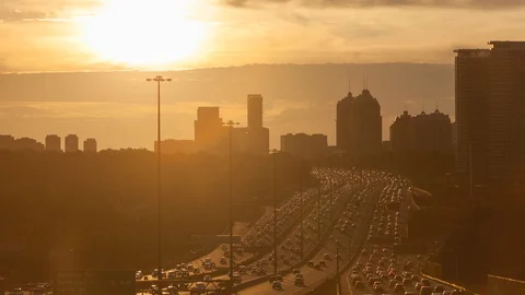 Sun setting behind Highway 401, Toronto, Canada.  time-lapse (STATIC SHOT) Stock Footage 129897849