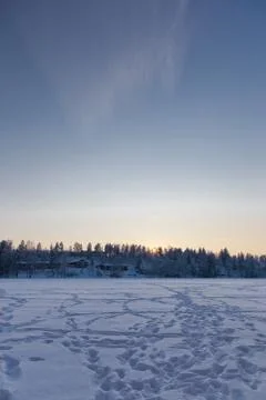 A sun setting behind a hill Stock Photos