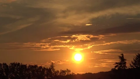 Sun setting behind the horizon timelapse Stock Footage 159075445
