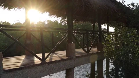 Sun setting behind jetty Stock Footage 170260087