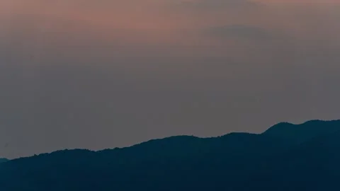 Sun Setting Behind Mountain Ridges At Dusk 4K Stock Footage 341865008