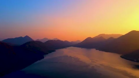 Sun is setting behind mountain (Sunset). Video stock 300280386