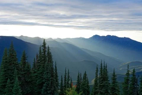 Sun setting behind the Olympic Mountains Stock Photos