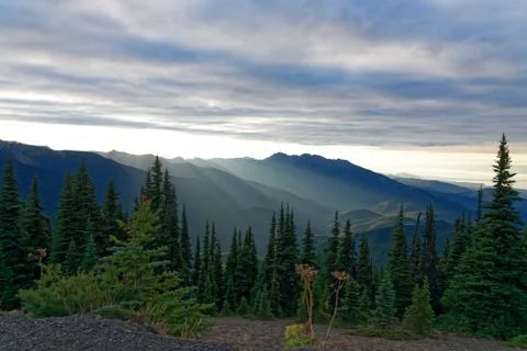 Sun setting behind the Olympic Mountains Stock Photos