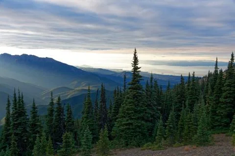 Sun setting behind the Olympic Mountains Stock Photos