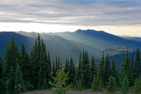 Sun setting behind the Olympic Mountains Stock Photos