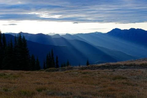 Sun setting behind the Olympic Mountains Stock Photos
