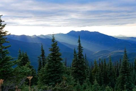 Sun setting behind the Olympic Mountains Stock Photos