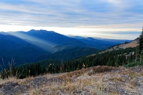 Sun setting behind the Olympic Mountains Stock Photos