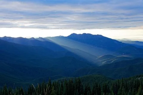 Sun setting behind the Olympic Mountains Stock Photos