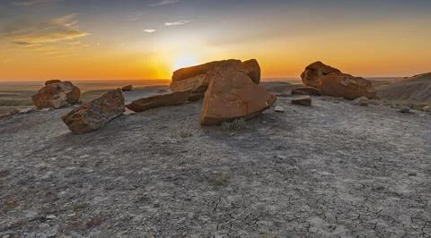 Sun Setting behind Rocks at Red Rock Coulee Stock Photos