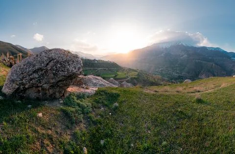 Sun setting behind the slope of Mt. Damavand, the highest stratovolcano in Asia Stock Photos