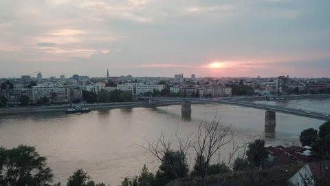 Sun setting behind Varadinski Bridge and Novi Sad, Serbia, pan right-Rec709 Stock Footage 93259994