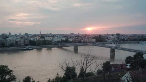 Sun setting behind Varadinski Bridge and Novi Sad, Serbia, pan right-Rec709 Stock Footage 93260028