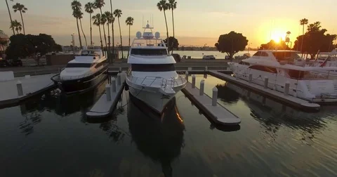 Sun Setting Behind Yachts Stock Footage 77524692