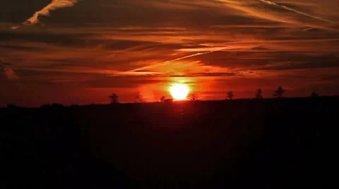 Sun setting below the hill side - time lapsed Video stock 41609326