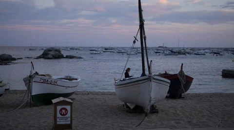 Sun setting, boats of Calella 스톡 동영상 55800711