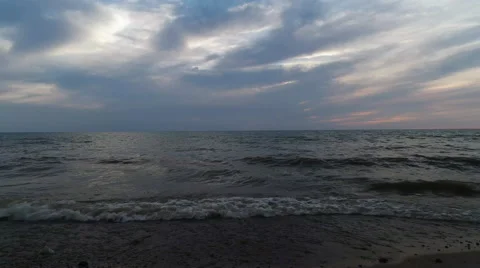 Sun setting into the clouds over Lake Michigan Stock Footage 52483356