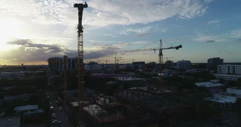 Sun setting on construction cranes in Edgewater Stock Footage 172506956