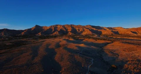 Sun setting on desert mountains in Fruita Colorado drone aerial Stock Footage 82188965