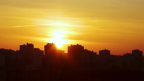 Sun setting down over a city Stock Footage 160825308
