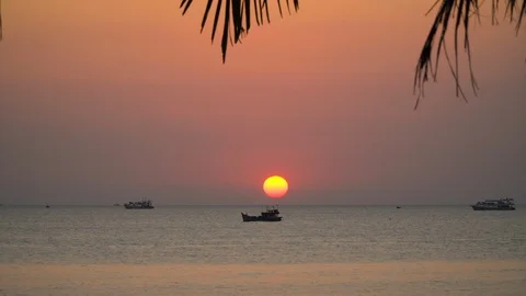 Sun setting down over an ocean. Beautiful golden sunset at the sea Timelapse 4K Stock Footage 108037278