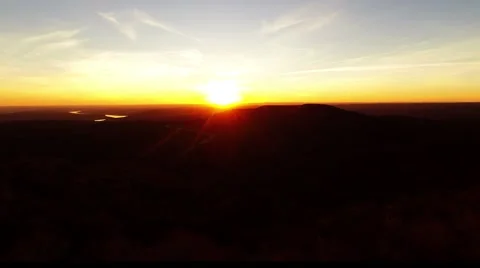 Sun setting in the hill over the trees Video stock 45674143