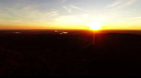 Sun setting on the horizon Stockbeeldmateriaal 45674090