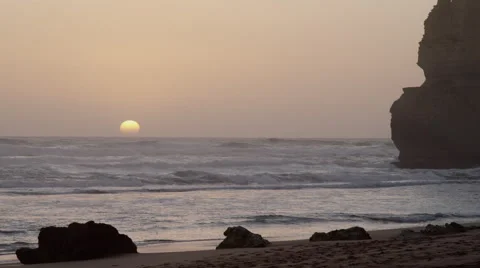 Sun Setting on Horizon with one of the 12 Apostles - Australian Outback Video stock 46161438