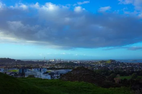 Sun setting into the horizon. The view is from high ground green mountain Stock Photos